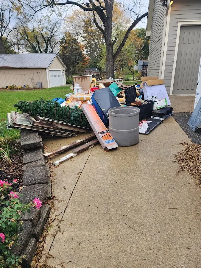 Dumpster being loaded with debris for 30 Yard Dumpster Rental in Yellow Springs